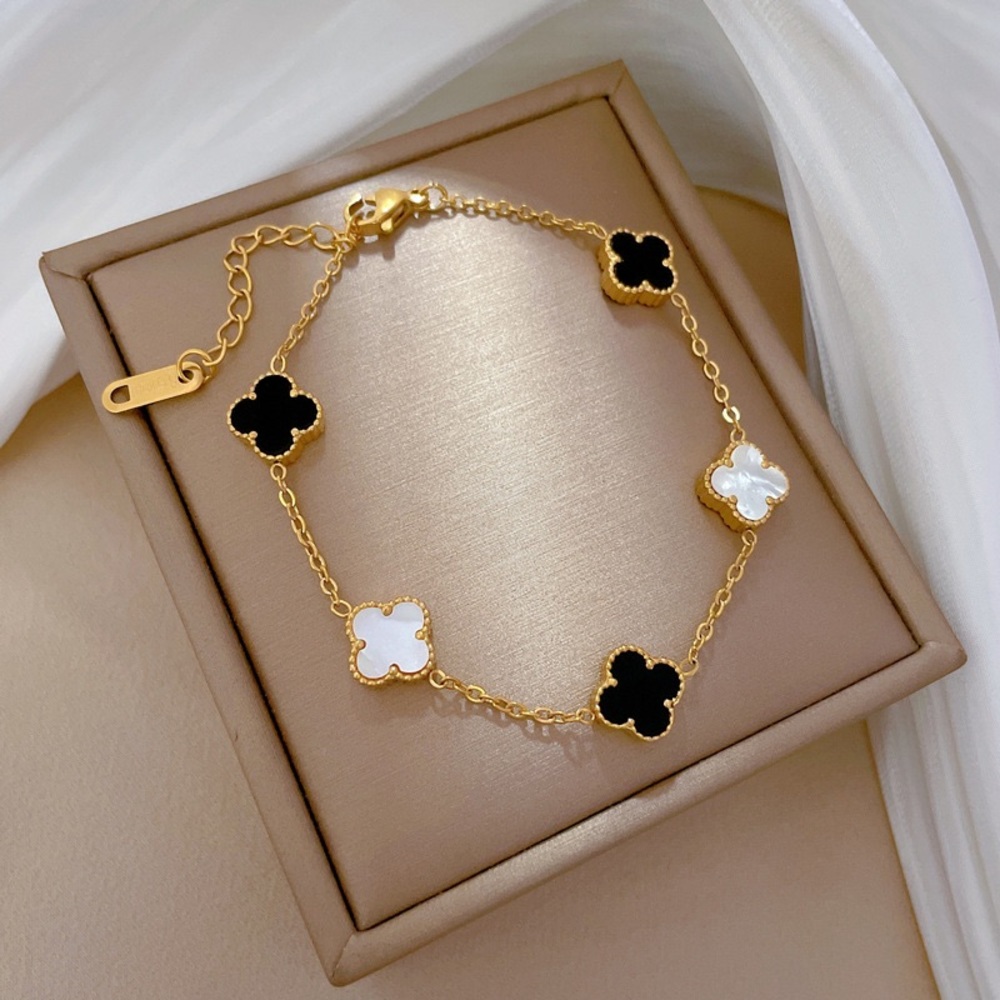 Black & white clovers reversible gold bracelet